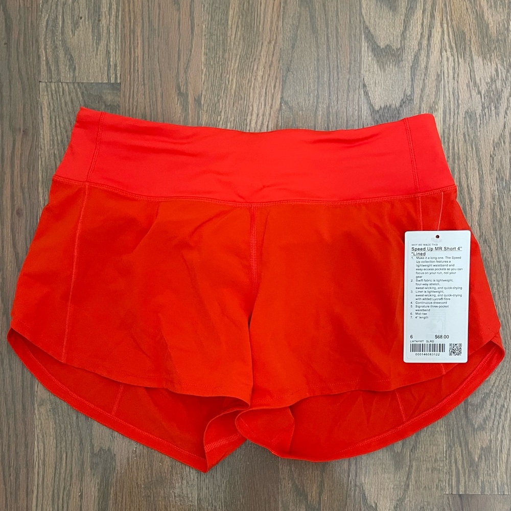 NWT Speed up mid rise short 4” in solar orange